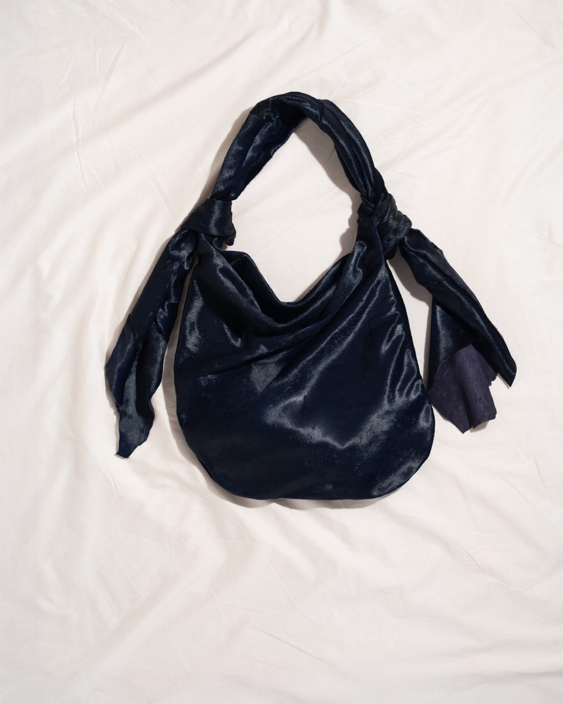 bb sack in navy hair on hide