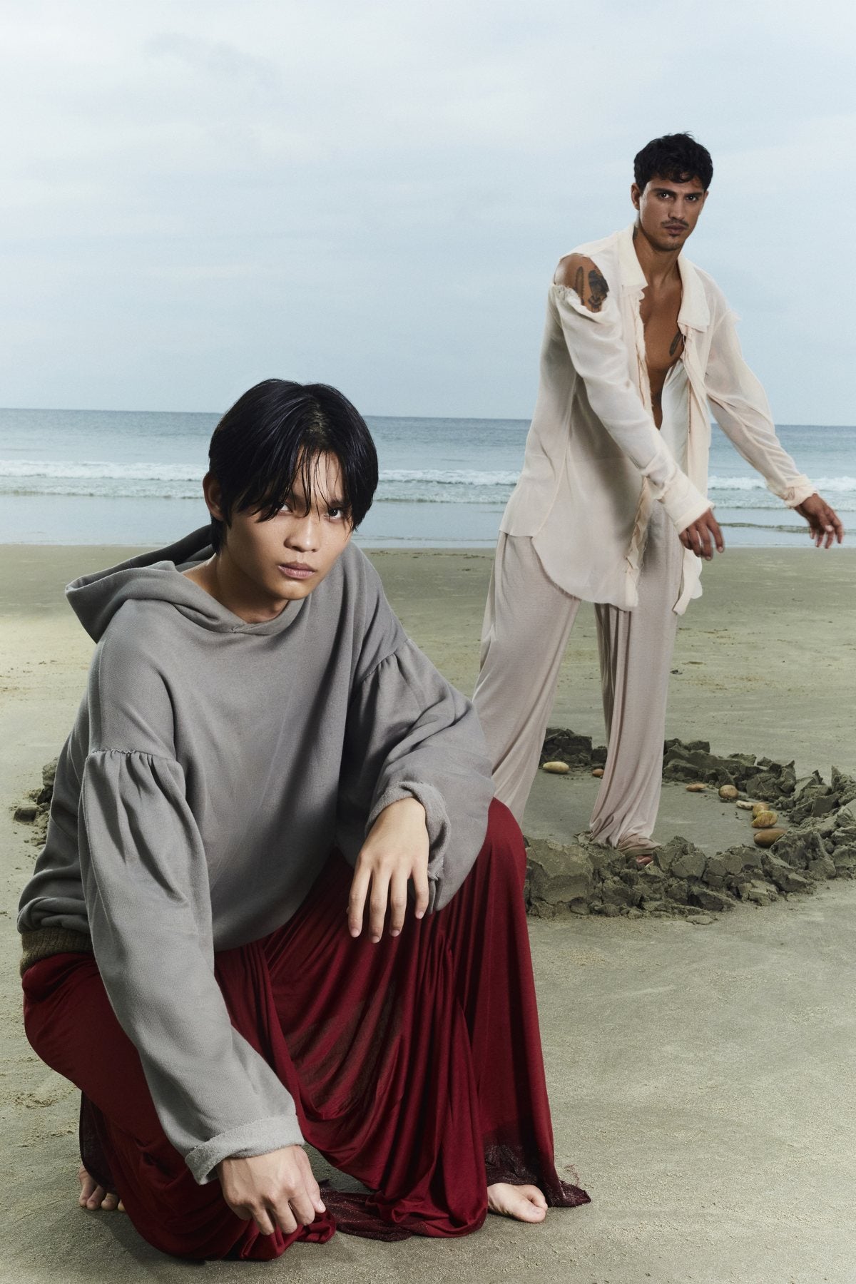 Magia — beach — grey hoodie and red skirt
