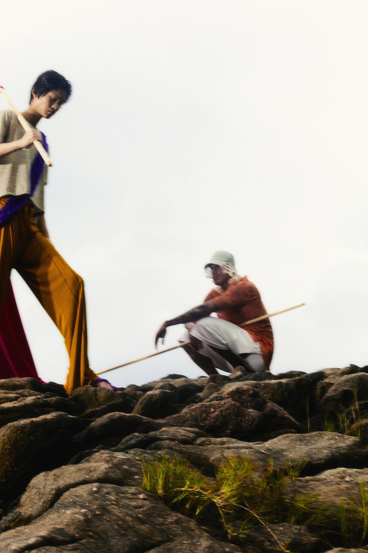 Magia — rocks — flags, two figures